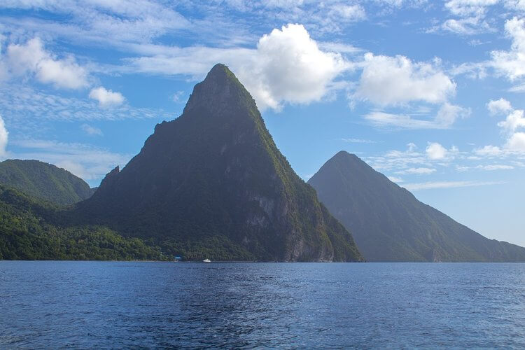 a breathtaking view of the iconic twin volcanic peaks rising above the lush landscape