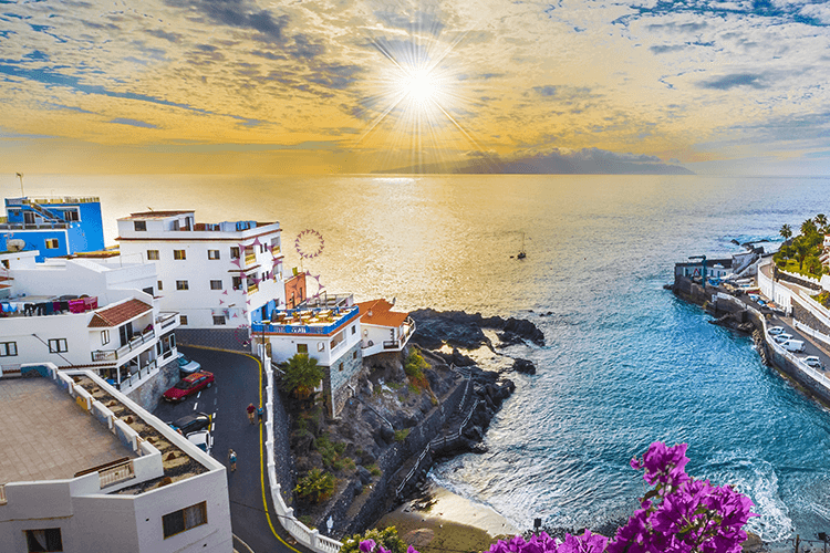A stunning beach with a vibrant city in the background, offering a picturesque blend of nature and urban life