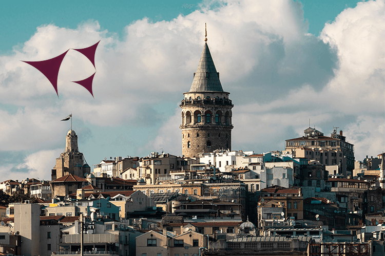 A cityscape with a towering structure and a vibrant